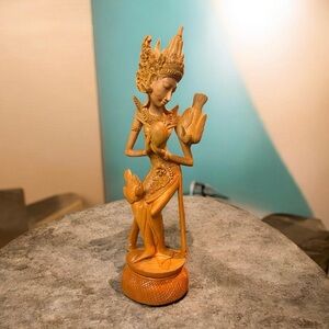 Indonesian hand-carved wood sculpture inspiration goddess Dewi Saraswati.